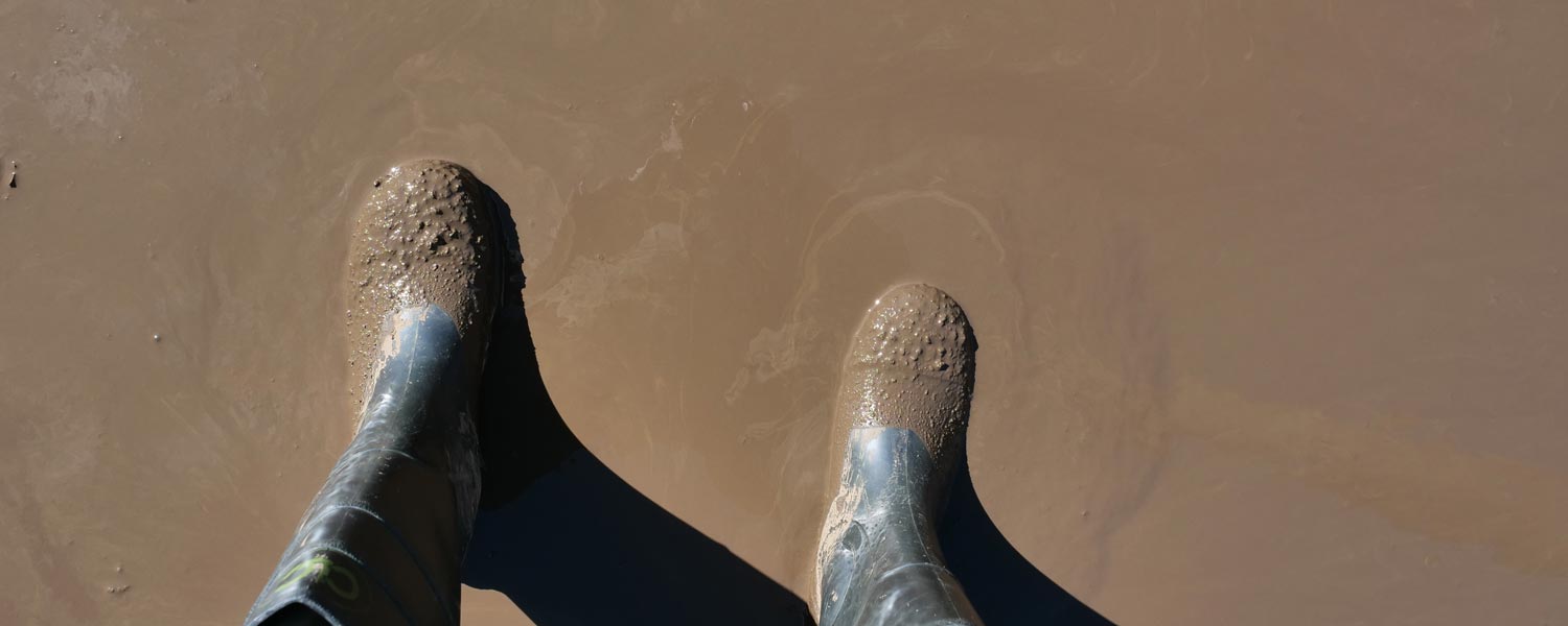 Rubber boots in thick mud