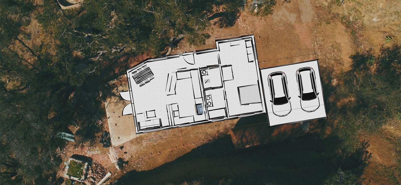 Aerial view of the property with the planned house layout drawn over it